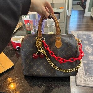 Louis Vuitton Brown Satchel with Red and Gold Accents